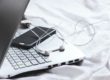 laptop and cell phone with headphones
